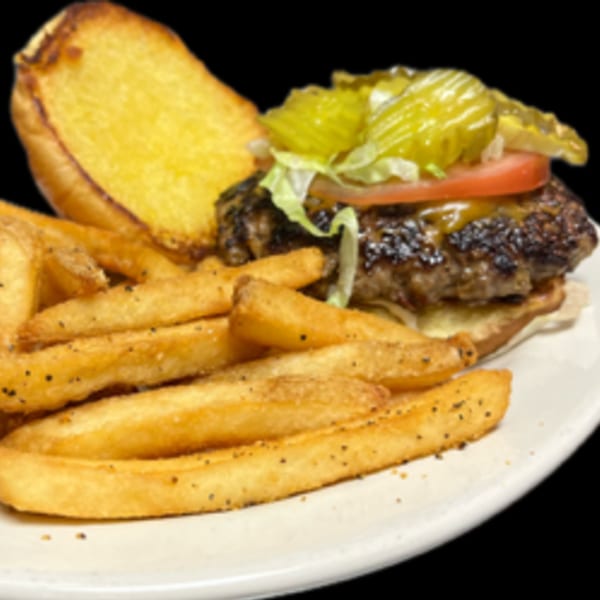 A Krawfish Kai cheeseburger with lettuce, tomato, pickles, and a side of seasoned fries.